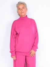 Knitted sweater with high neck
